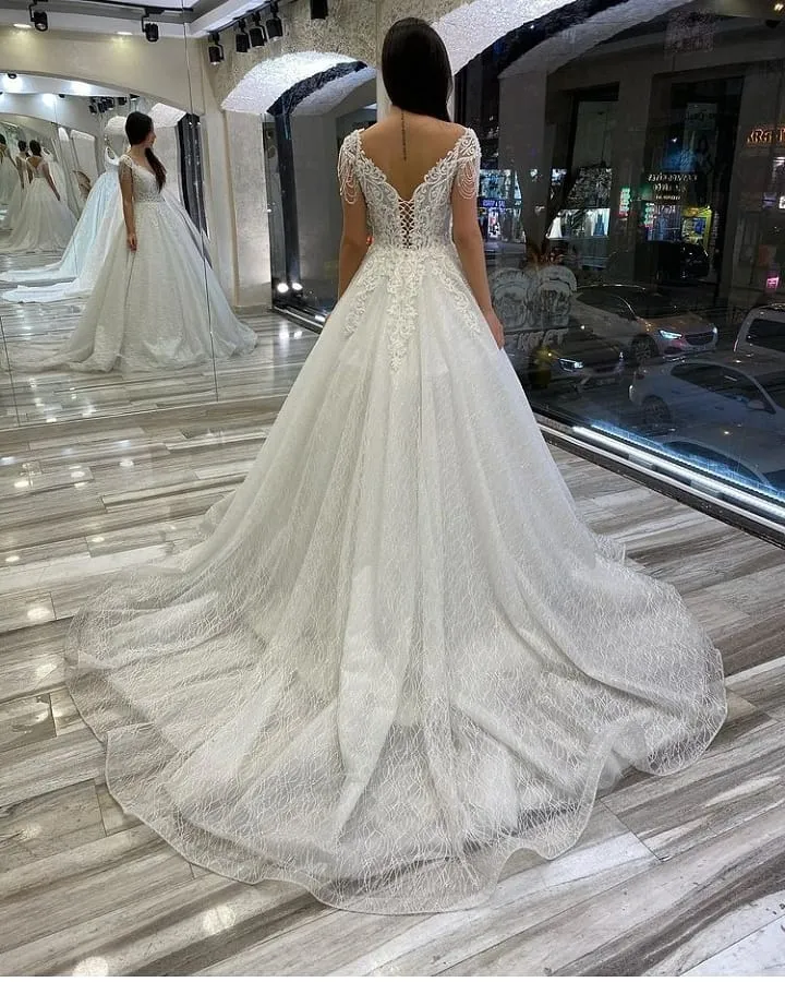 A-Line Wedding Dress Sweetheart Backless With Train Sequins Appliques Lace