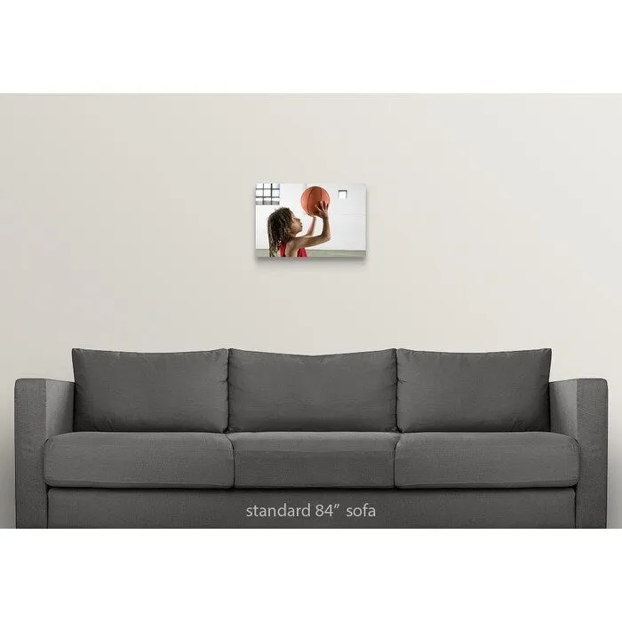 "Boy aiming a shot with a basketball in a school sports hall." Canvas Wall Art